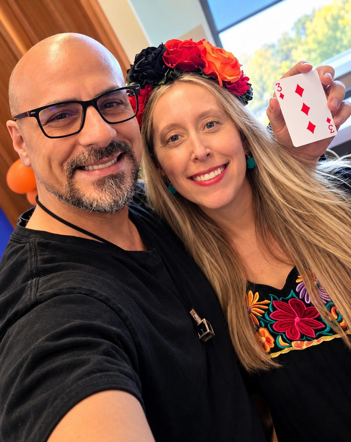 Eric Mina with Clarios organizer Stephanie holding the card he predicted