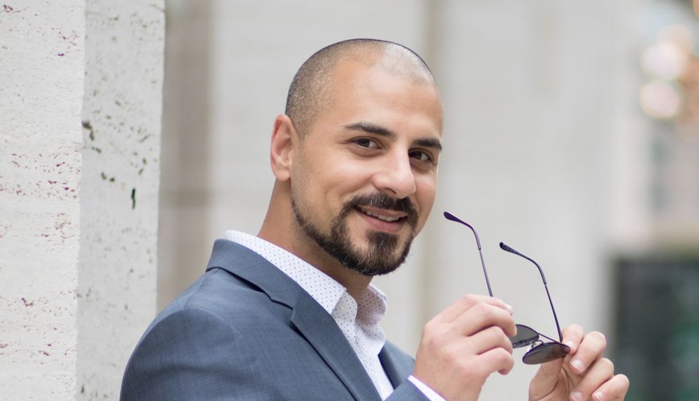 Eric Mina at a formal reception